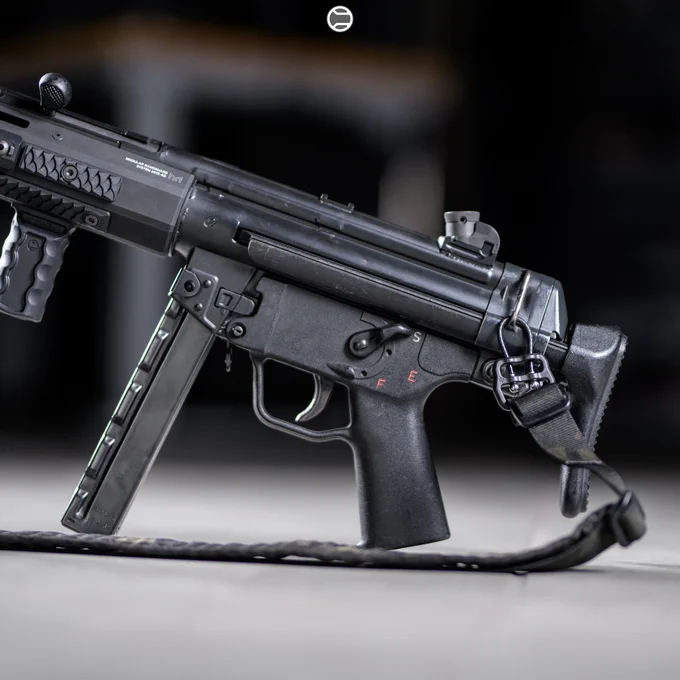 RailScales QTR Stop, RSBM-P Polymer M-LOK VFG, HTP MLOK Scales (Dragon, Black, 2.5-Slot), HTP Solo's (Dragon, Black, 1.5-Slot), Hardtop Mount for Scout Light Pro Lights | Heckler & Koch MP5SD, Hitec Arms HP5SD Receiver, Dakota Tactical MHS-SD M-LOK Rail w/ The One Cage, B&T USA MP5SD Suppressor, Surefire M340C-Pro Light w/ CSM-07 Pressure Switch, Ferro Concepts MultiCam Black Slingster w/ Blue Force Gear ULoop Sling Attachments, HK MP5 30rd Straight Mag, HK SEF Trigger Housing, HK SEF Full Auto Trigger Pack, HK SEF Long Axle Selector Lever, HK MP5 A3 Retractable Buttstock. 