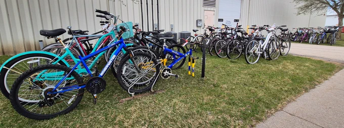 Various bikes lined up in rows outside Surplus.