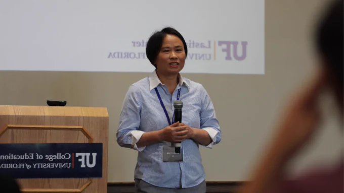 Person at the front of a room presenting