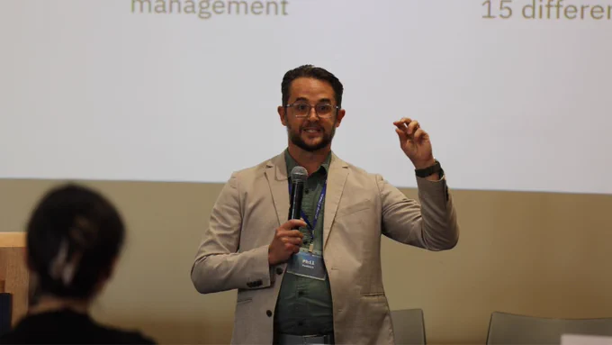 Person at the front of a room presenting