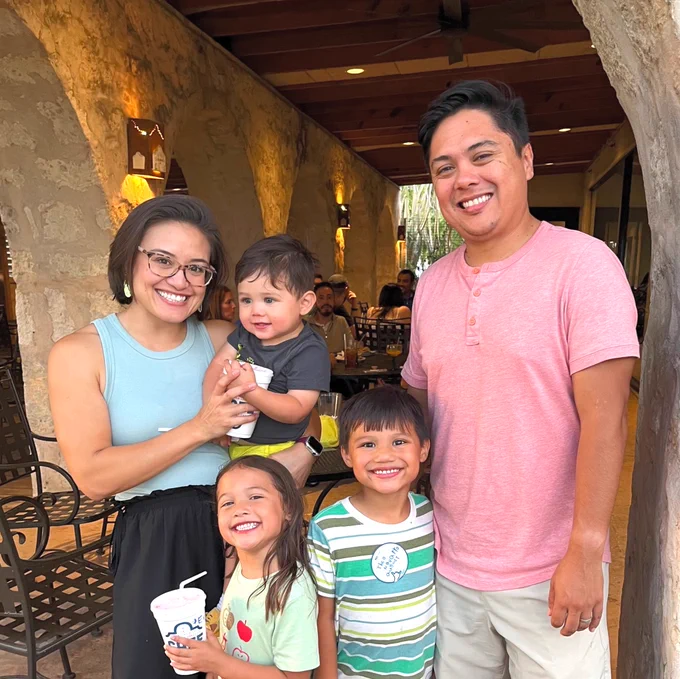 Two Texas A&M University-Corpus Christi alumni and their three children pose for a family photo at the annual San Antonio TAMU-CC alumni fiesta.
