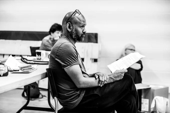 Ramesh is seated in a rehearsal room holding a script