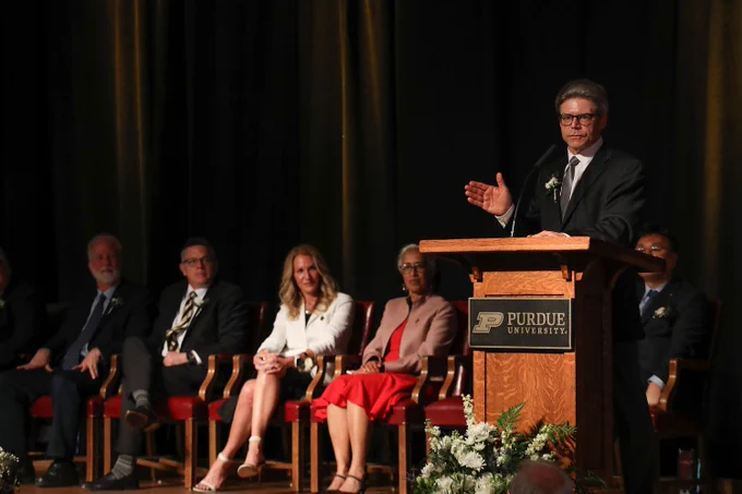 Jeff Russell, UW-Madison Dean of Continuing Education and Professor of Civil and Environmental Engineering standing at a podium giving a speech.