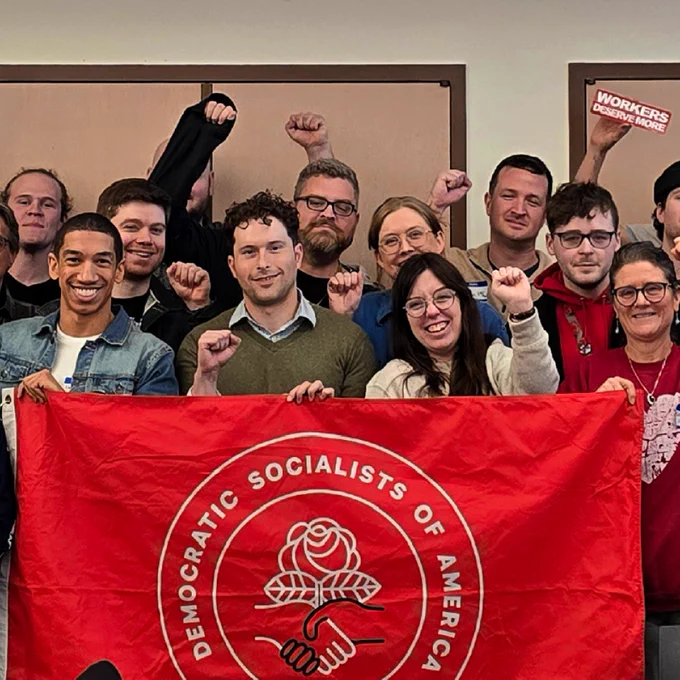 This is a group of Snoco DSA members smiling and posing with a DSA banner.