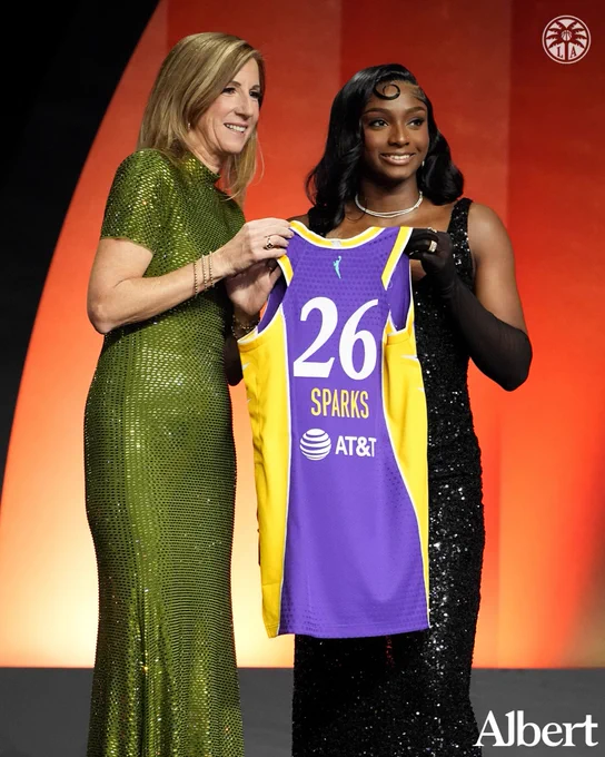 Commissioner Cathy & Ta’Niya Latson holding up Sparks jersey