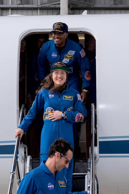 Artemis II Pilot Victor Glover (top) and Mission Specialist Christina Koch (center) return home to Houston, stepping off a plane at Ellington Airport near NASA's Johnson Space Center, on Saturday, April 11, 2026, following their 10-day mission around the Moon. They launched April 1, 2026, from NASA’s Kennedy Space Center in Florida, and splashed down off the coast of California on Friday, April 10, 2026. Credit: NASA/DAVID DEHOYOS