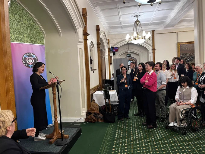 Labour for Trans Rights Parliamentary Reception. Nadia Whittome MP is speaking at a microphone and lectern.