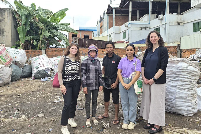 Five people, including Mary Schletzbaum, far right, stand together at the former Stung Meanchey landfill outside Phnom Penh, Cambodia.
