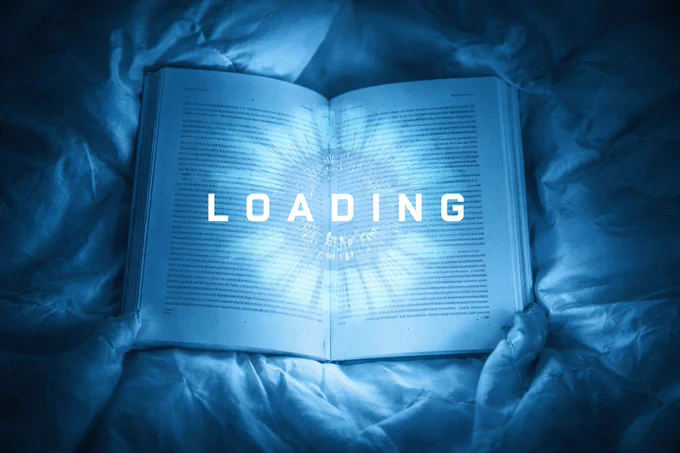An open book lying on rumpled blue sheets. A glowing, digital "LOADING" progress bar and circular icon are superimposed over the pages, radiating a bright blue light.