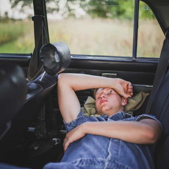 Motion sick person in the back of a car

Photo by Elvis Bekmanis on Unsplash