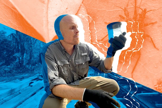 A photo of doctor Norman Beatty holding up an insect container in the field. Blue and orange stylized graphic elements behind him bisect the photo from the top left corner to the bottom right corner.