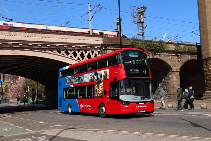Go North East 6392 (MA75CTZ) is a red and blue Wright Streetdeck Ultroliner and is pictured under the railway bridge on St Nicholas' Street as if heads to Peterlee on route X1. 