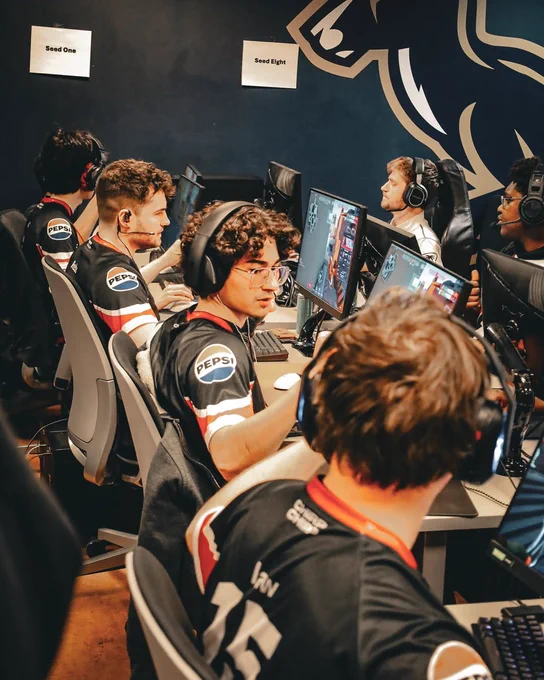 Ball State Esports players in Pepsi-sponsored jerseys compete at gaming stations.