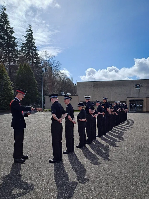 Police officers standing on the parade square at the Scottish Police College, Tulliallan.