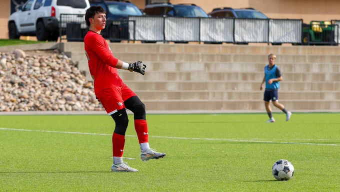 Zach MacDonald clears the ball from goal during training 