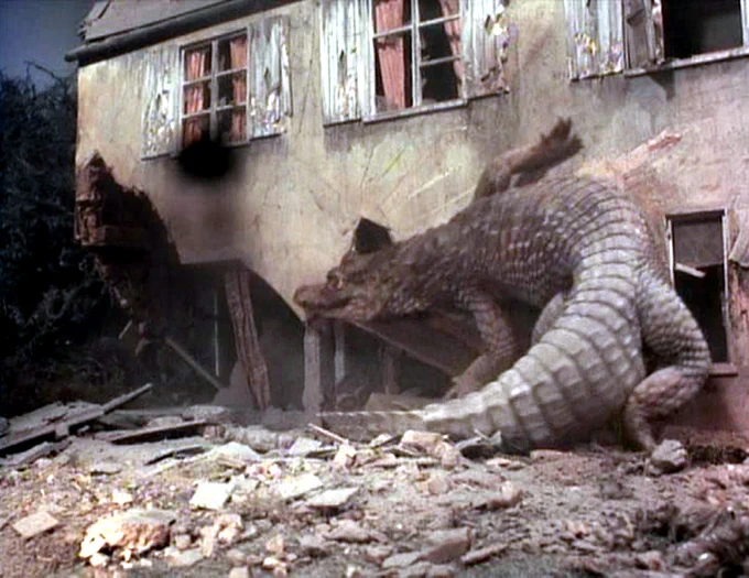 Giant alligator attacking a house