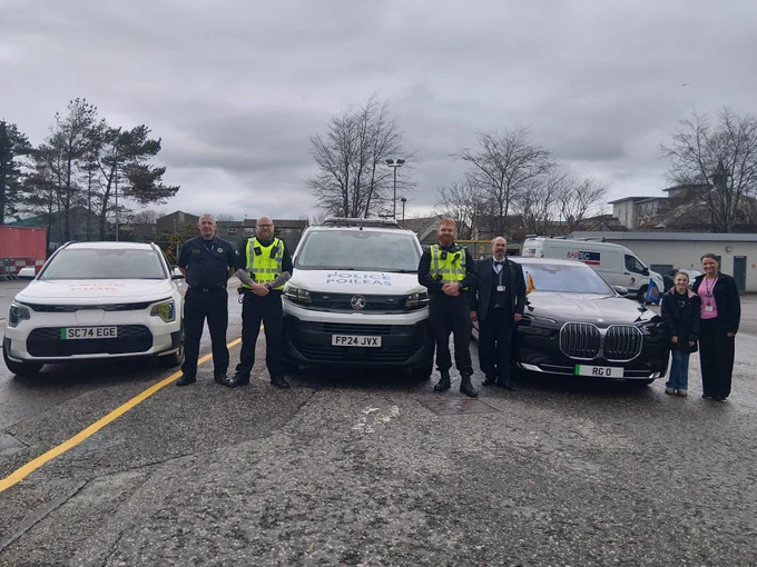 image shows Police, Fire and Council staff in attendance at aberdeen breakfast club, along with their vehicles and some attendees.