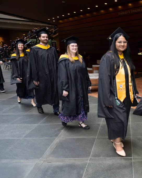 Students at graduation waiting in line.