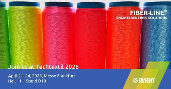 Six colorful spools of engineered fiber—green, yellow, pink, red, orange, and blue—stand vertically in a row. Promotional text reads: "Join us at Techtextil 2026," with dates April 21–24, 2026, at Messe Frankfurt, Hall 11.1, Stand D18. "Fiber-Line Engineered Fiber Solutions" is in white text at the top right, and the Avient logo appears at the lower right on a blue banner.