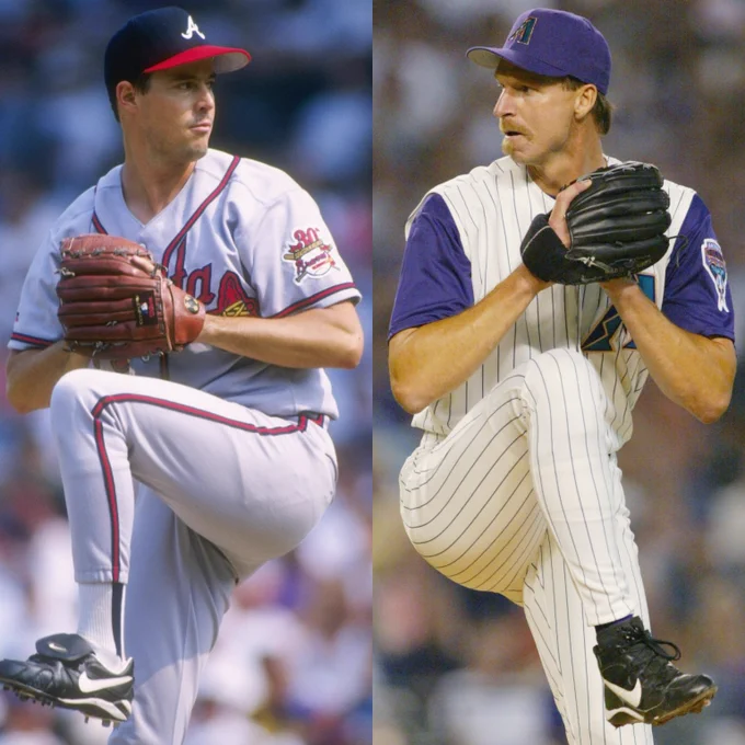 Left, Greg Maddux delivers a pitch wearing a gray Atlanta Braves uniform with red lettering. Right, Randy Johnson delivers a pitch wearing a white Arizona Diamondbacks uniform with pinstripes and purple sleeves.