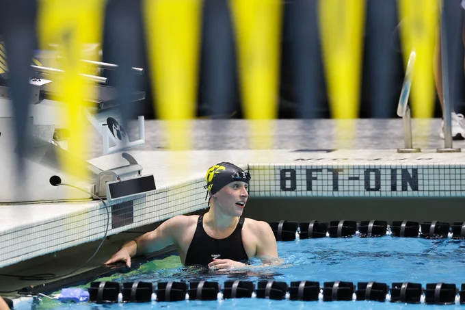 Rachel Dildine checks her time after completing a race at the Campus Recreation and Wellness Center.