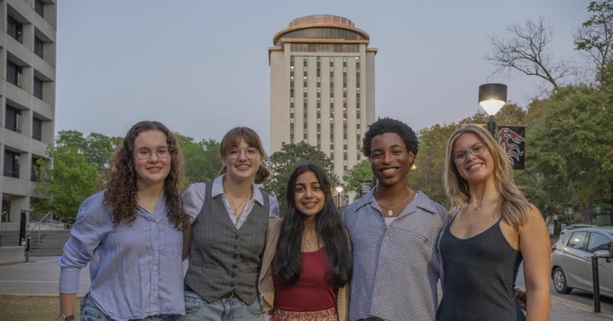 Photo of five Goldwater scholars standing in front of Capstone House with the top lit up garnet. Caption. It’s LIT! #ICYMI: Capstone was glowing garnet last month to celebrate our five Goldwater Scholars, who set a university record! Congratulations once again to Reagan Stanton, Hannah Keen, Khufu H., Ria Kothari and Ansley Martin!