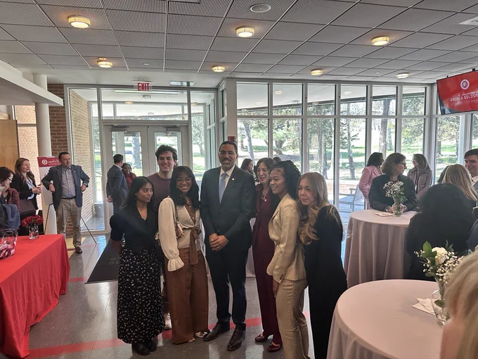 Chancellor King with students at the fireside chat event.