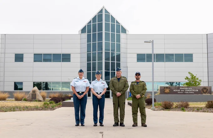 From left to right, Royal Canadian Air Force Chief Warrant Officer Renee Hansen; Lieutenant-General Jamie Speiser-Blanchet, Commander of the Royal Canadian Air Force, Lieutenant-General Huddleston, Deputy Commander of NORAD, and Chief Warrant Officer Plamondon, Canadian Element NORAD Chief Warrant Officer, stand outside NORAD Headquarters, April 14, 2026.