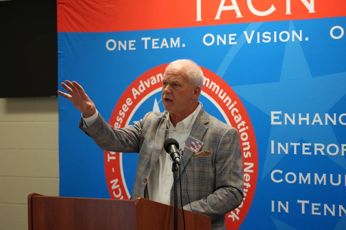 Dickson City Mayor and ECD Chairman Don Weiss speaking at a podium in front of the TACN backdrop.