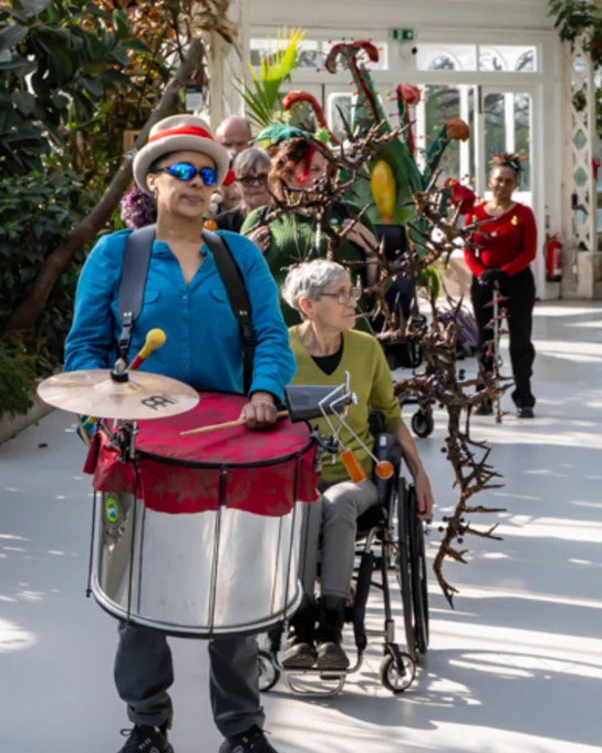 Disabled artists and performers take part in the ‘Pimp My Wheelchair’ launch parade curated by Faith Bebington and Janet Price at Sefton Park Palm House. Credit Brian Roberts