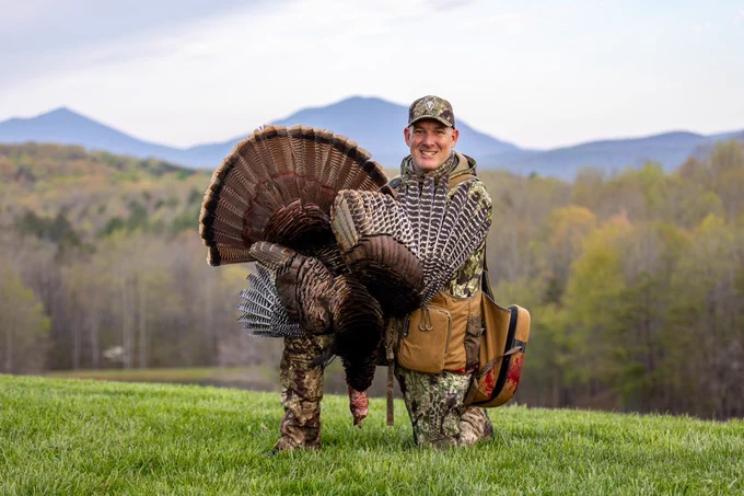 A hunter with a turkey.