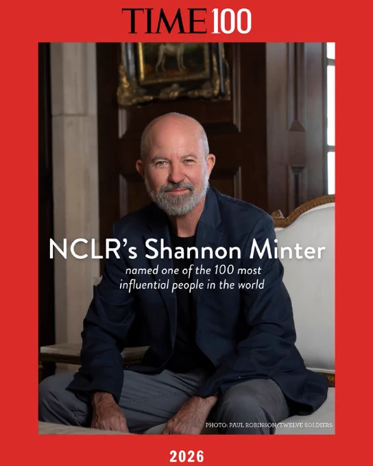 TIME100 Red magazine border. 2026 is at the bottom of the frame. 
In frame: NCLR's Shannon Minter is in a casual blue and grey suit. He sits in a white wooden chair, next to a marble wall. He smiles slightly and looks directly into the camera. 

Words: NCLR's Shannon Minter named one of the 100 most influential people in the world. 