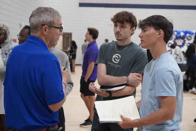 Two JEFCOED Students speak to a representative of a company during JEFCOED’s Industry Connection Day.