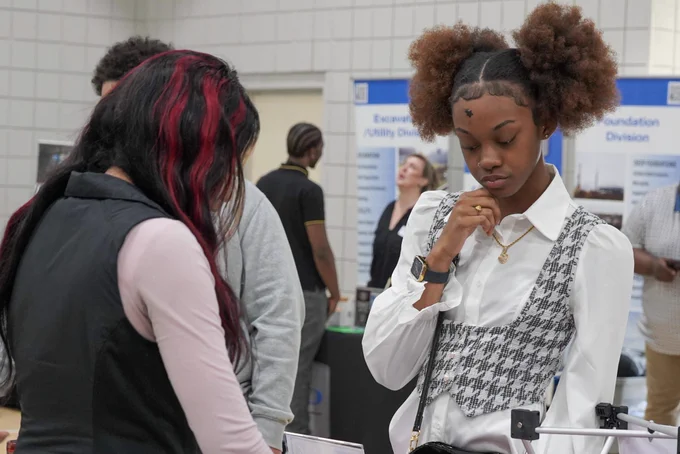 A JEFCOED student speaks with a representative of a company during the JEFCOED Industry Connection Day.