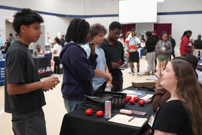 Students speak with representatives of a company during the JEFCOED Industry Connection Day.