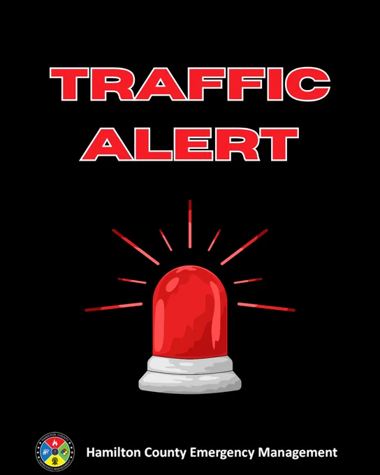 Black background with red siren. Red letters indicate Traffic Alert.