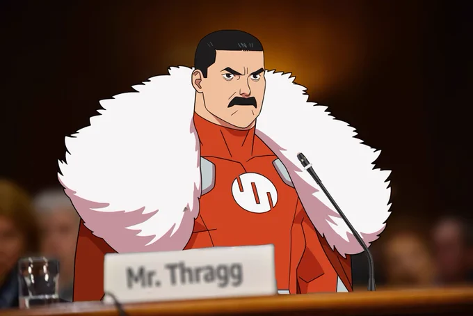 Thragg testifying before Congress. His name card reads "Mr. Thragg"