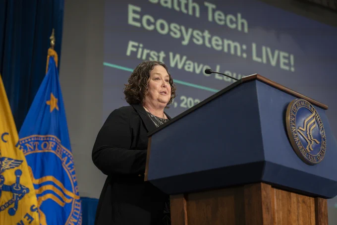 CMS's Amy Gleason speaking on stage for the Health Tech Echosystem event. 