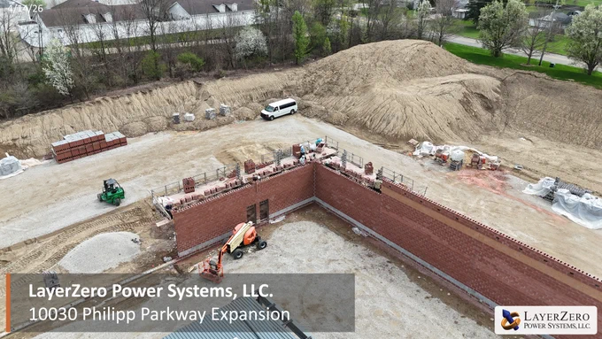 LayerZero expansion at Philipp Parkway showing exterior wall construction and roofed sections of the new manufacturing facility