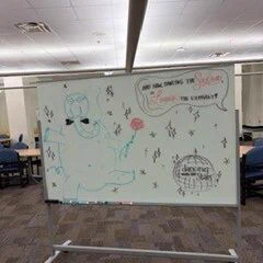 Artwork by UCO Student on a library whiteboard. 