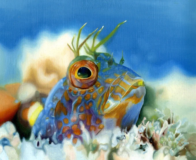 
Artwork of blue fish with orange markings peeking its head out from the bottom of the sea floor