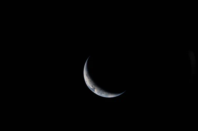 Crescent Earth seen from the Artemis II Orion spacecraft. Credit: NASA