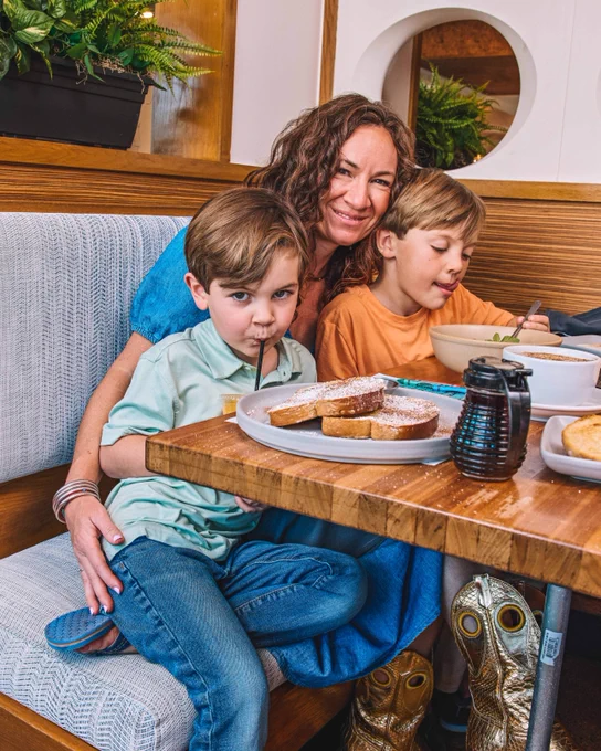 Kerbey_Lane_Cafe_Family_Smiling_Booth_Brunch_Easter_Sunday_French_Toast_Pancakes_Syrup_Juice_Kids_menu_Playground_Adults_Cocktails