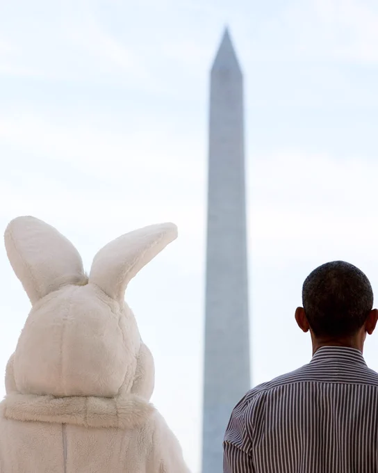 Image of former President Barack Obama standing next to the Easter Bunny looking at the Washington Monument.