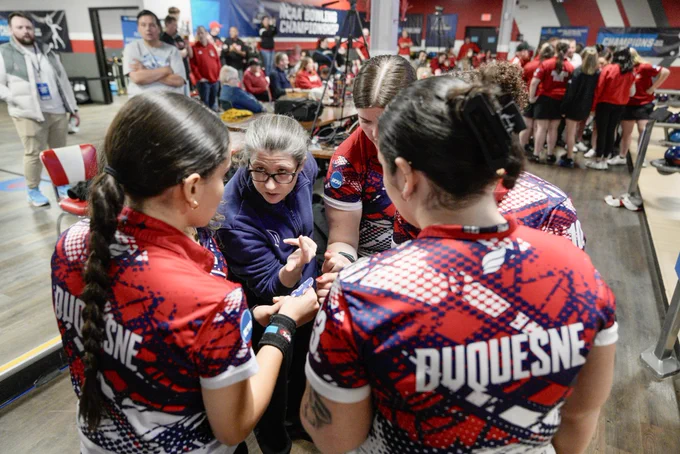 Bowling team huddle