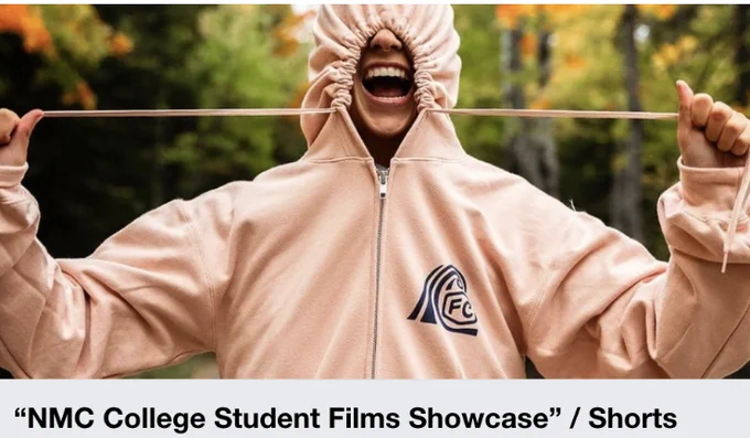 A person playfully pulls the strings of their light pink hoodie to cover their face, standing outdoors with trees displaying autumn colors in the background. Text below reads, “NMC College Student Films Showcase / Shorts.”