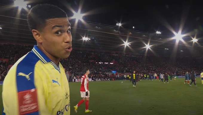 A screenshot of Shea Charles looking at the camera following the full time whistle and puffing his cheeks out. 