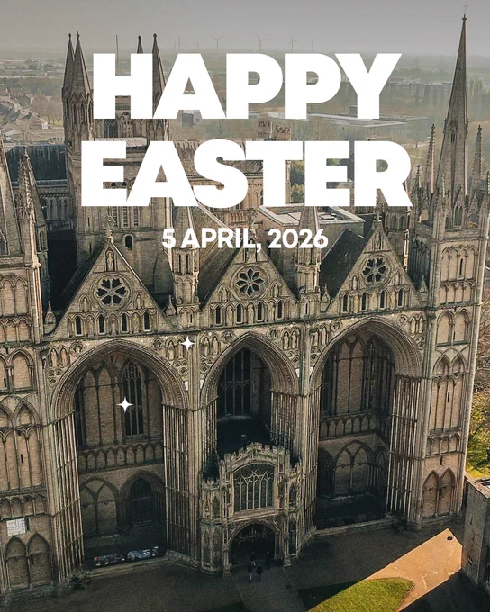 Aerial view of a historic Gothic cathedral featuring intricate stonework, large arched windows, and towering spires. The sky is hazy. Overlay text reads "HAPPY EASTER" with the date "5 April, 2026."