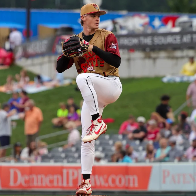 Photo of George Klassen winding up to throw a pitch.