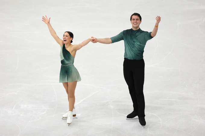 Luke and Ana celebrating on the ice